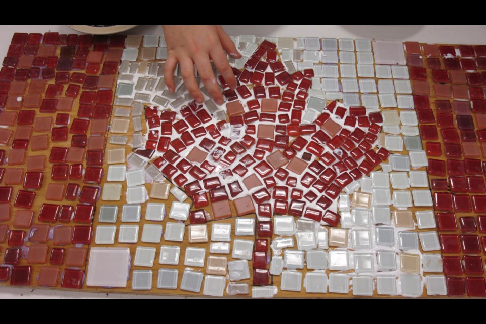 The mosaic created by students and their grandfriends to celebrate the anniversary of the Canadian flag.
