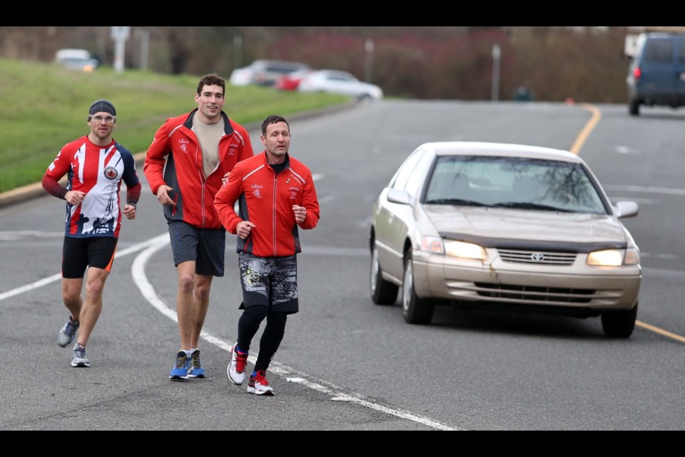 Sebastian Deschamps, left, Lorne Guthro and Channing Knull near Mile Zero during the 2015 Wounded Warrior Run. This year's event is set for Feb. 19 to 25.