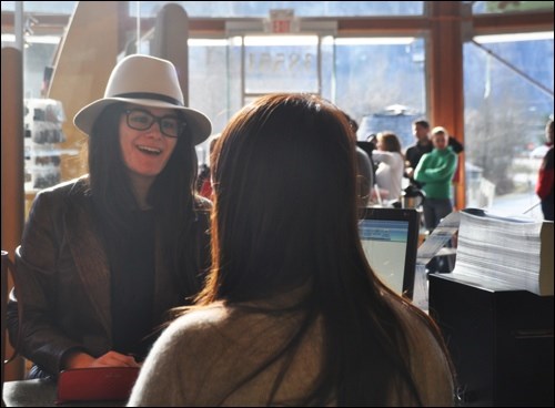 A Squamish resident completes her ticket order during the locals only pre-sale event at the Squamish Adventure Centre on Sunday (Feb. 22).