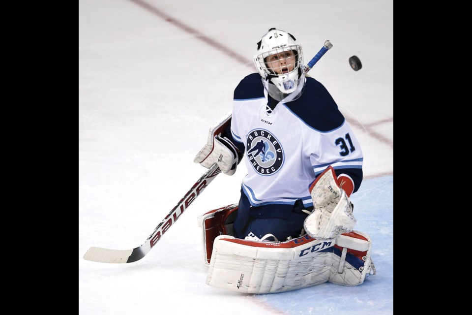 Team Quebec goalie Maude Trévisan keeps her eye on the puck Friday at CN Centre during the Canada Winter Games.