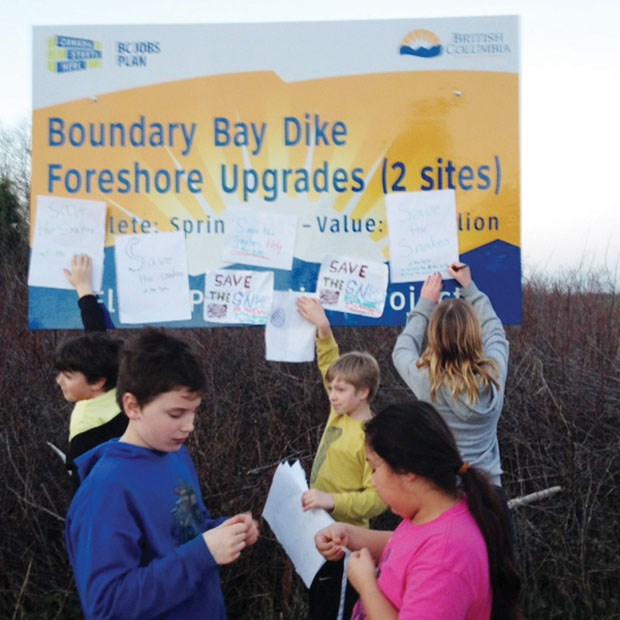 Beach Grove Elementary students made signs in an effort to save the snakes.