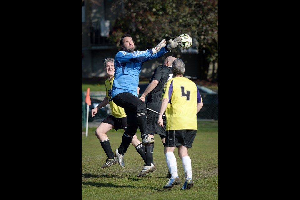 03-08-15
PCOV Lusitanos ns Carribean All-Stars in masters soccer at Sapperton park. Photo: Jennifer Gauthier