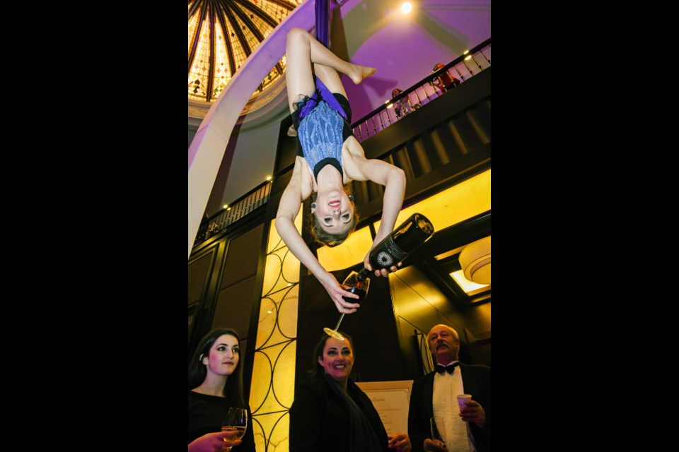 Aerial silk performer Julia Siedlanowska poured drinks for those in attendance for both Hush Wedding Soiree and The Groom Show this past Saturday at Terminal City Club. Photograph by: Rebecca Blissett