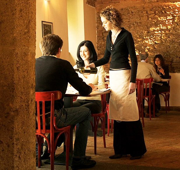 Restaurant with waitress serving