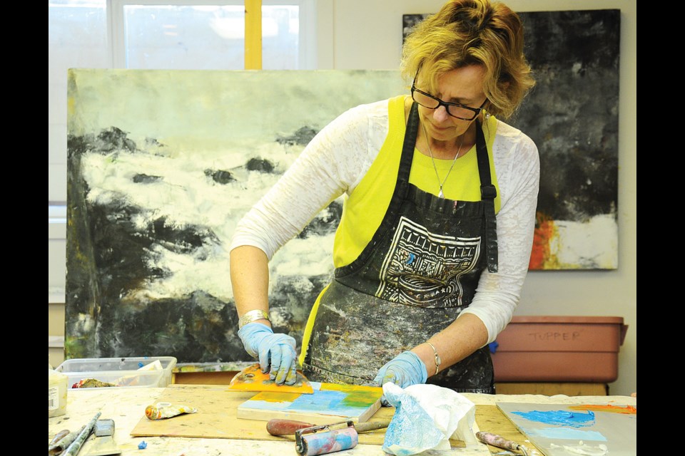 Nicola Morgan demonstrates her painting technique at 195 Pemberton Studios.