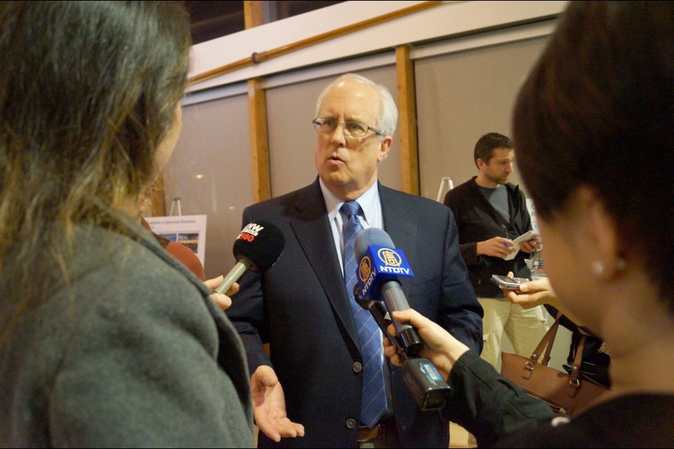 Mayor Malcolm Brodie is interviewed by Chinese media at the UBC Boathouse on March 12, 2015 during a city-run workshop on foreign signs. Brodie said he believes a sign bylaw mandating English or French on signs is not necessary as he would prefer to focus on community integration through programming.