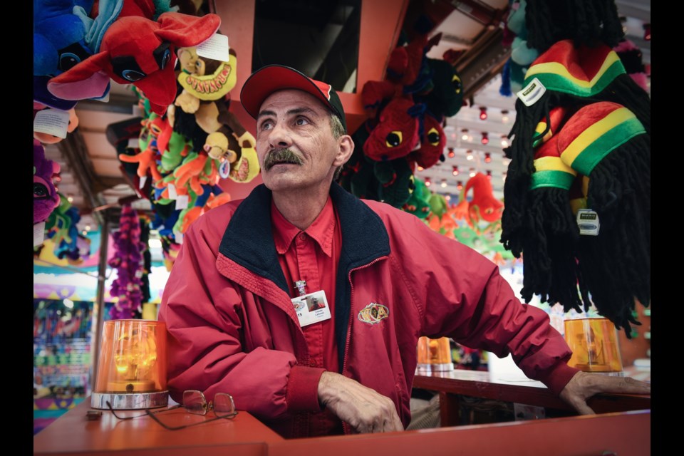 Claude Leforest manned the Wac ‘A’ Mole carnival game during Saturday’s opening of PlayDome at BC Place. Leforest, from Armstrong, B.C. celebrates his 21st year as a West Coast Amusements employee this year. Photograph by: Rebecca Blissett