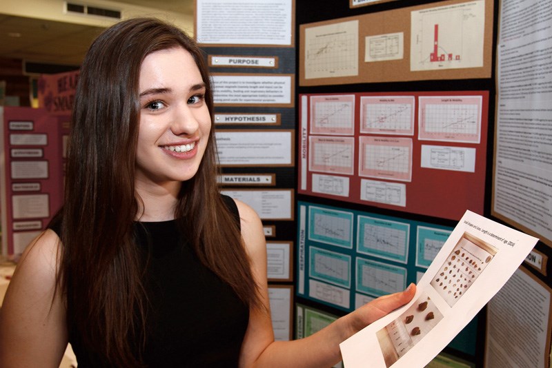 Fraser Lake secondary school Grade 10 student Elizabeth Schulz, 15, explains her Central Interior Science Fair project Investigating Correlations & Variations of Lymnae stagnalis, which looks at the size of pond snails and whether size has any relationship to how well they work for research.