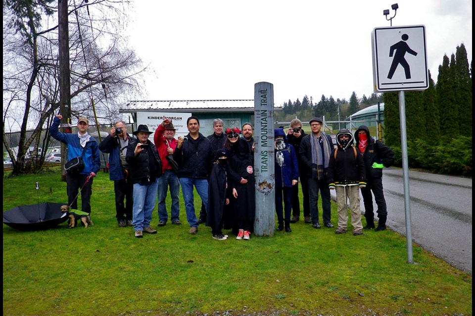 Protesters gathered to take photos at the Kinder Morgan tank farm, an activity that has triggered police investigations of New Westminster residents Tim Takaro and Lesslie Askin.