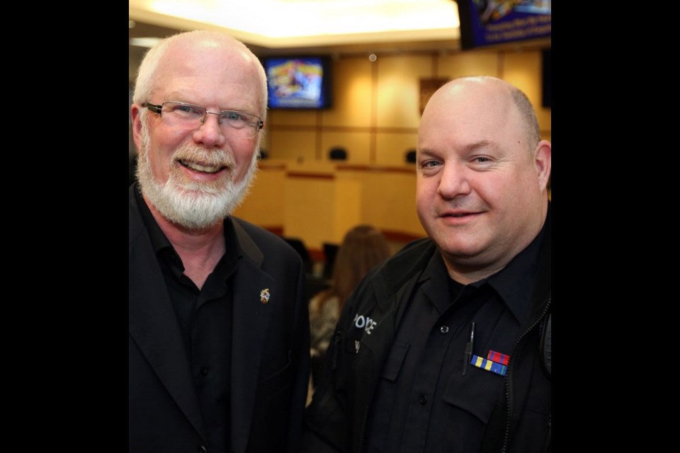 Victoria Police board member Peter Ryan with Sgt. Sean Plater.