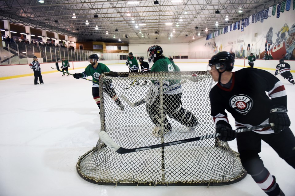 The Craft-Beer All-Stars look to clear the zone in a game against Parallel 49 Brewing Co. check during Saturday’s Beer League BASH tournament. Parallel 49 fell 5-1 to Red Truck in the championship final. Photograph by: Rebecca Blissett