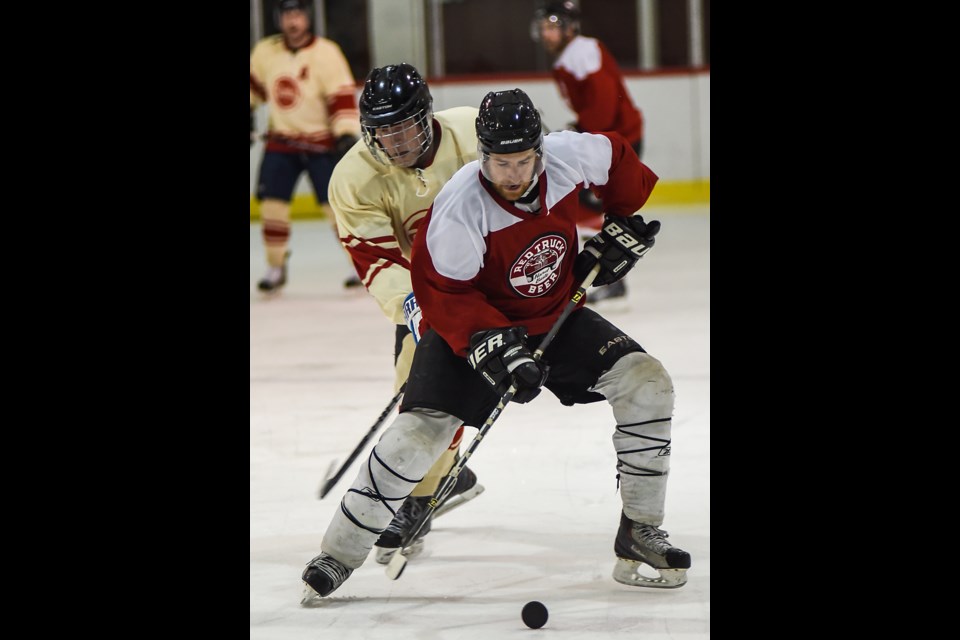 A Red Truck Beer Company player showed off some East Van sock tape style against host Bomber Brewing during Saturday’s Beer League BASH tournament at Britannia Rink. The Red Truck team went on to take home the championship trophy with a 5-1 win over Parallel 49 Brewing Co. Photograph by: Rebecca Blissett