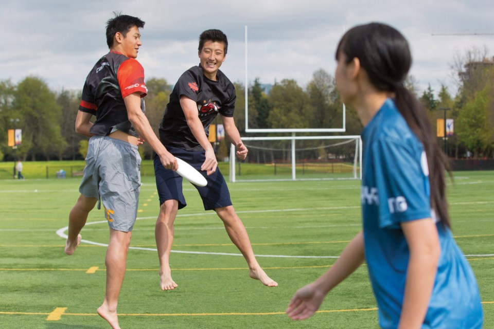 National team ultimate players Veronica Ng, Edward Guo and Nick Lin have a little fun at Minoru Park.