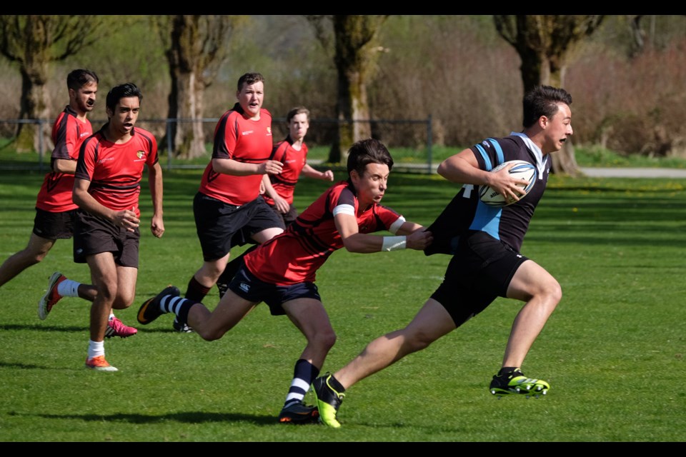 Bby central ( red) AAA vs. Moscrop in BNW high school senior boys tier 2 rugby at Bby lake east