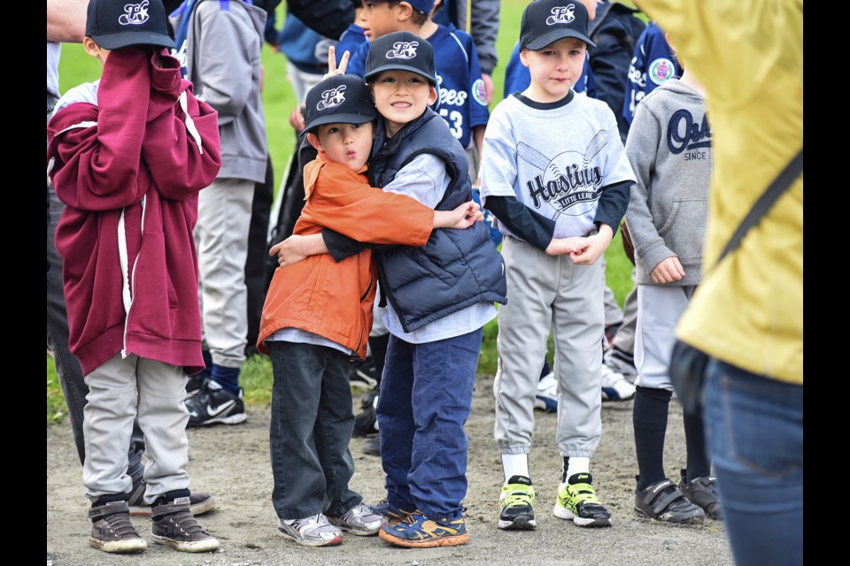 Hastings Community Little League players pose for a photograph during Saturday’s opening day ceremonies at Falaise Park. The league started in 1953 and is run by many long-time volunteers. Photograph by: Rebecca Blissett