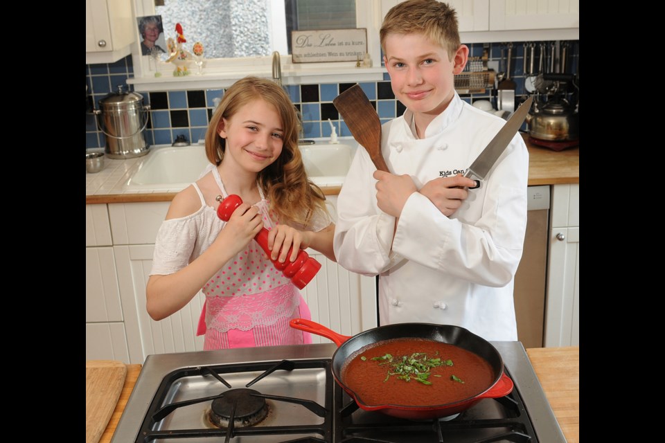 Chloe and Skylar Sinow are practising their pitch for their taping of the Dragons’ Den TV show next week. Photo Dan Toulgoet