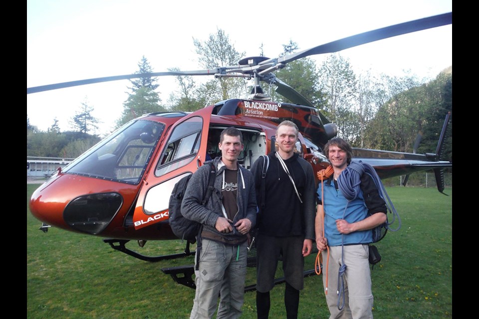 Climbers Tomas Sedlak, left, Jan Fultner and Ladislav Placek are safe after being transported off the Stawamus Chief from Squamish Search and Rescue. They had been climbing just metres from the rockfall Sunday.