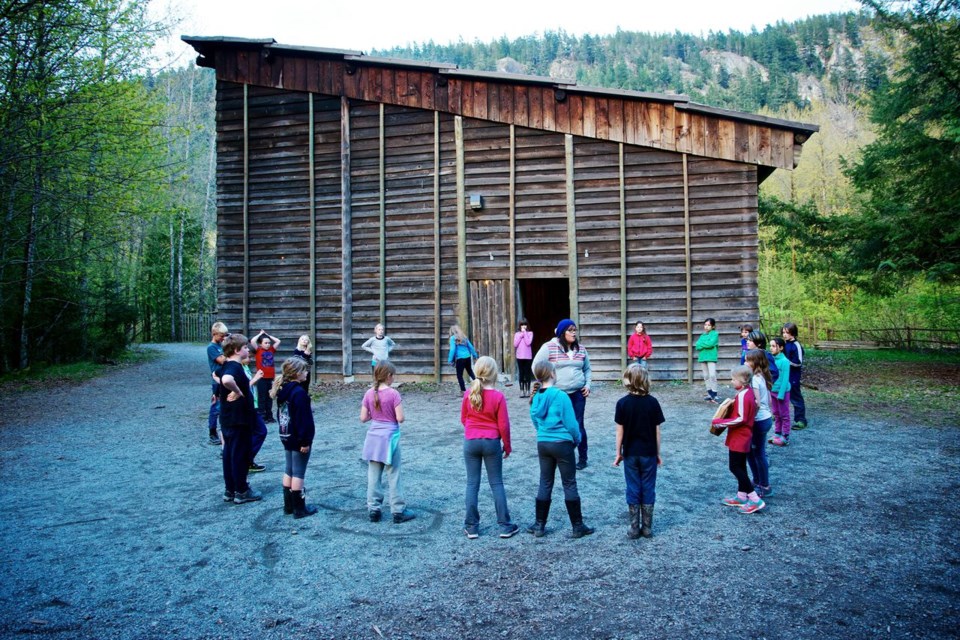 Students learn to dance at the Bighouse with an elder.