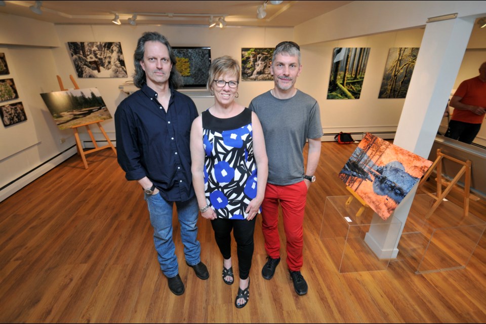 Photographers Chris MacKenzie, Kelly Selden and Adam Gibbs at the opening of the Photographic Convergences exhibition at Deer Lake Gallery.