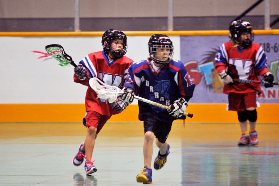 051015 - New Westminster, BC
Chung Chow photo
Dorothy Robertson Lacrosse Jamboree at Queen's Park Arena
Tyke girls - New Westminster (red) vs Ridge Meadows (Meadows wins 7-3)