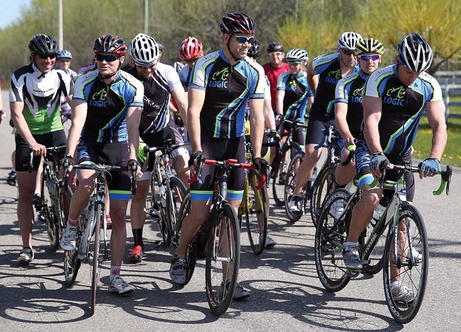 Cyclists get ready during a mass start to the PG Cycling Club's Road Race. 23 cyclists participated and took to the roads of Pineview Sunday morning.
