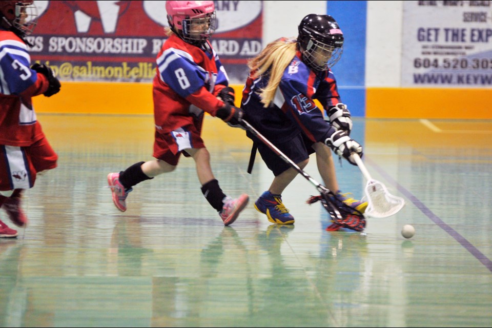 051015 - New Westminster, BC
Chung Chow photo
Dorothy Robertson Lacrosse Jamboree at Queen's Park Arena
Tyke girls - New Westminster (red) vs Ridge Meadows (Meadows wins 7-3)