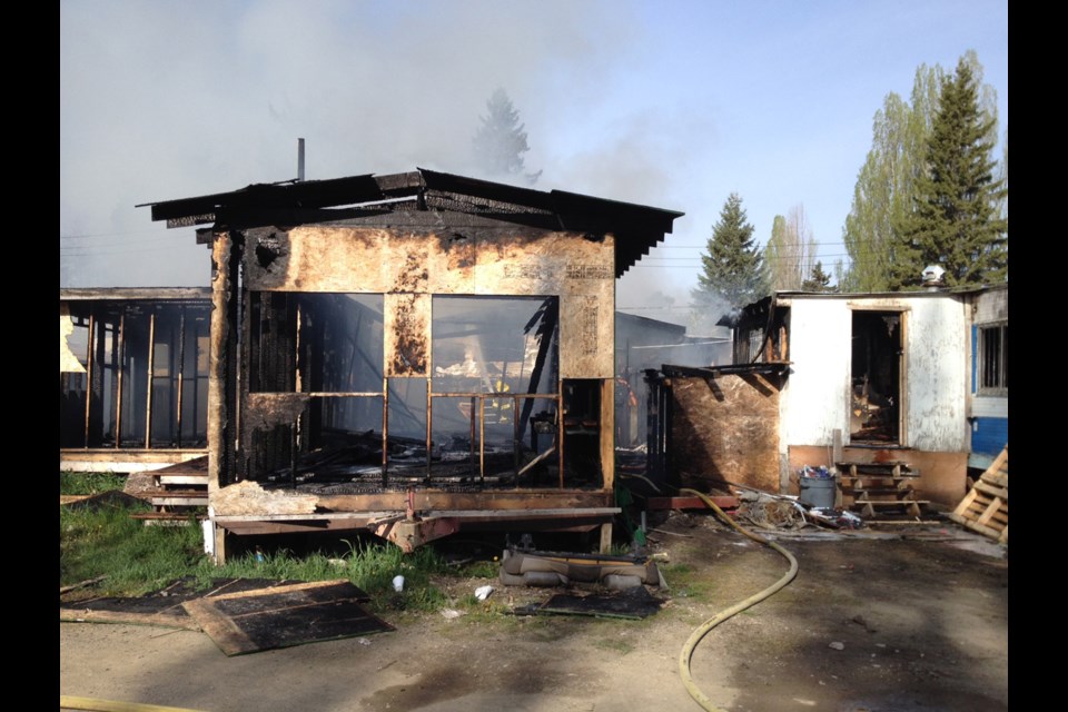 The structures that burned this morning on Norwood Street were vacant. There were no injuries.