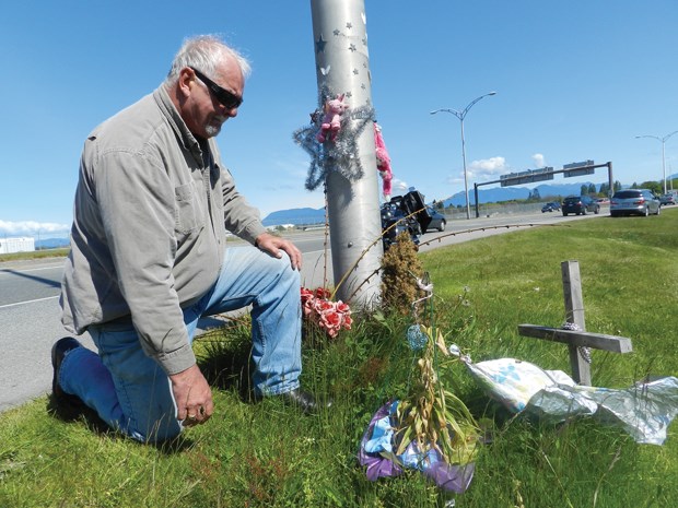 Ron Mahy visits the roadside memorial to his daughter, Christy who was struck by a vehicle at Russ Baker Way and the Dinsmore Bridge last July 30. Charges have yet to be laid in connection with the case as Mahy and his family seek answers to why the investigation has taken so long, and that the suspect has allegedly left Canada.