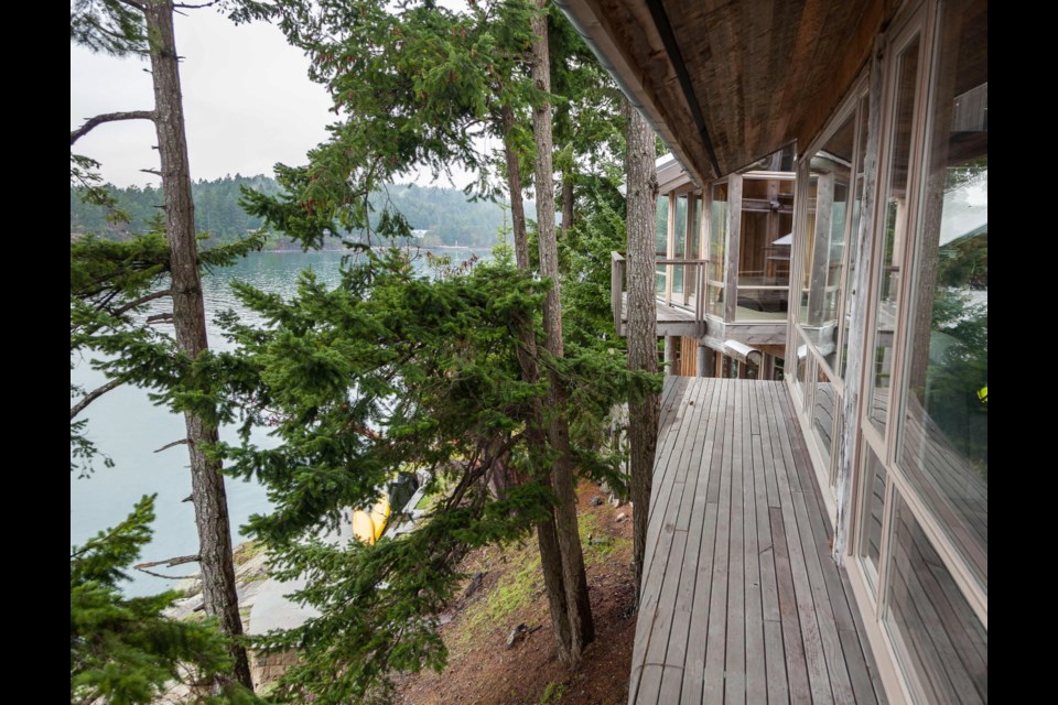 All the outside decks are untreated cedar. This one is designed to make window washing a breeze. "I love super-modern architecture, but I also love West Coast design and treehouses," says Donald Mackenzie.