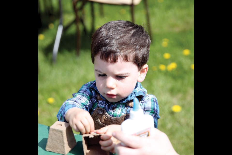 Ronan Mitchell, 2, is extremely focused while doing crafts at Huble Homestead. Sunday afternoon marked the opening day of Huble Homestead and was the first day of the "Springtime on the Homestead" which featured crafts, demonstrations and live music.