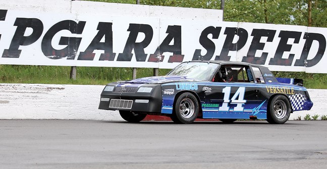 James Lewis does a couple warm up laps in his car in the Canadian Tire Street Stocks class on the first night of racing at PGARA Saturday night.