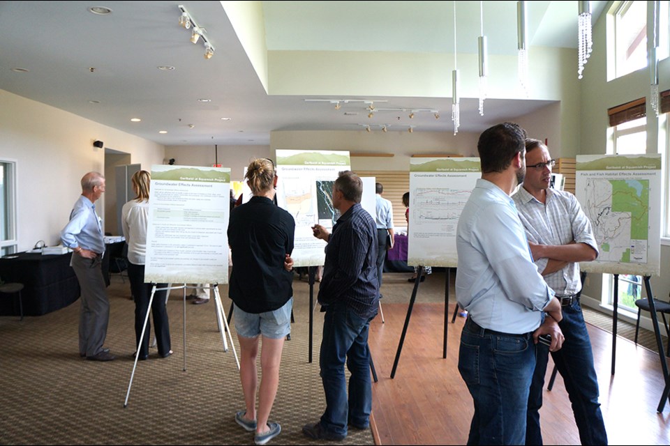People look at poster boards at the Garibaldi at Squamish EAO open house last Thursday, at Executive Suites Hotel & Resort.