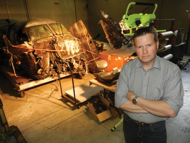 Alec Moffat, senior investigator and director of operations at Waldron, with wreckage of the Northern Thunderbird Air flight that crashed short of the runway at YVR in Oct. 2011.