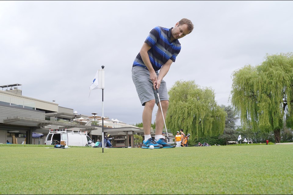 Putting at the Richmond Country Club.