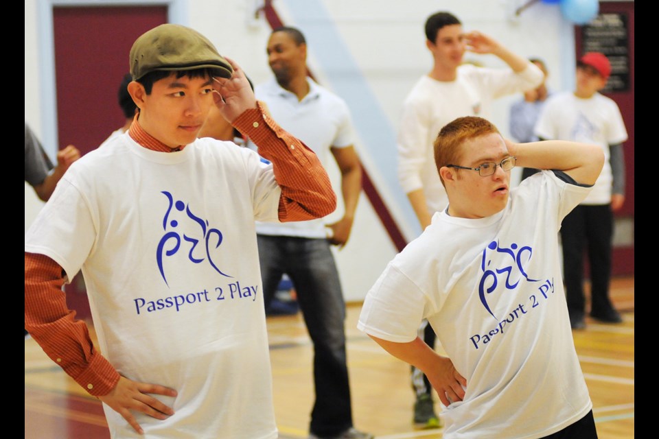 Timothy Phan (left) and Paya Hoosain Nia take part in the student-organized Passport 2 Play event at Hamber secondary Wednesday. Photo Dan Toulgoet