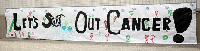 Here is the sign painted by the kids of Edgewood elementary for the fundraiser for the Cops for Cancer Tour de North. During this fundraiser, students, staff, parents and friends were invited to come down and for a $2 donation, they were given a paint balloon to throw at the favourite staff member.