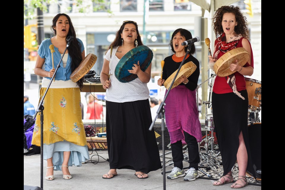 One of the many performances at the ninth annual Fair in the Square was the Wildflower Women of Turtle Island Drum Group. The celebration also featured a free bar-b-que lunch and arts and crafts and was hosted by Central City Foundation in partnership with Vancouver Community College all in the name of being a good neighbour. Photograph by: Rebecca Blissett
