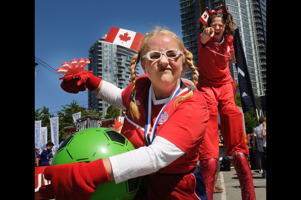 “Soccer Sistas” Heidi Spect and Jennifer Angeli entertained fans at the Vancouver FIFA Fan Zone in Larwill Park downtown as the World Cup arrived in the city Monday. See Friday’s Courier sports section for an ongoing schedule of games. Photo Dan Toulgoet