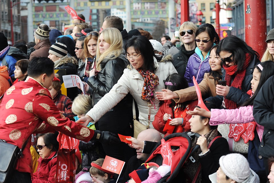 Vancouverites celebrate the Chinese New Year parade in Chinatown in 2014. Both Vancouver’s history and its future are intertwined deeply with Asia. Photo: Rebecca Blissett