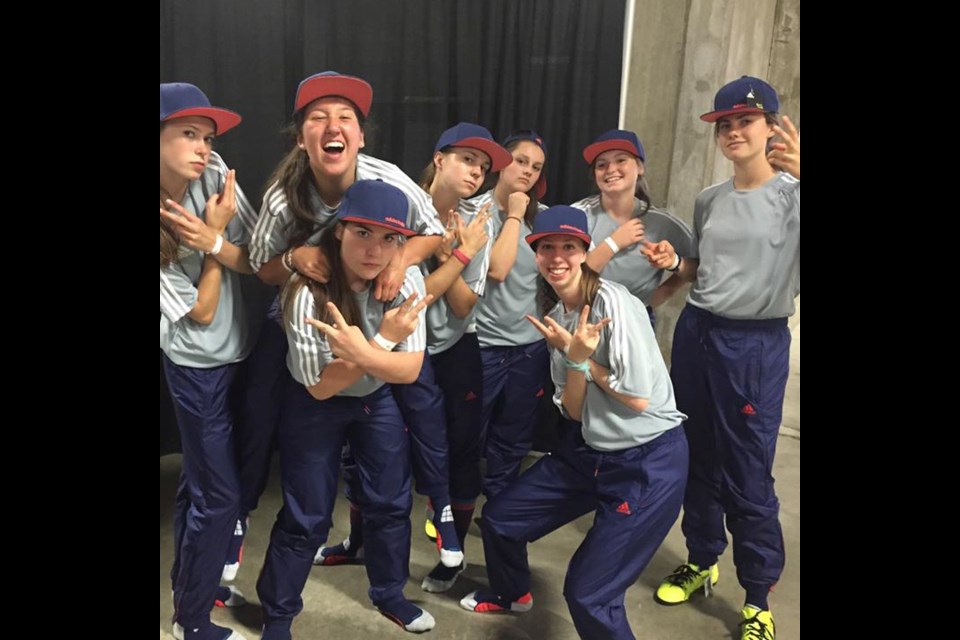 Members of the North Shore Girls Soccer Club get loose before hitting the pitch at BC Place to carry out their duties as ball girls for the FIFA Women's World Cup. photo supplied