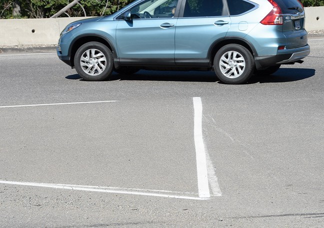 Line painting at Highland Drive at Foothills Blvd.