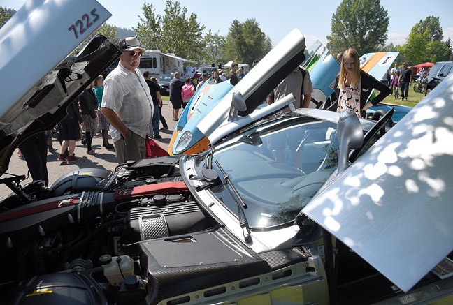 People check out a 2009 McLaren 7225 Roadster owned by Brent Marshall during the 41st annual Cruisin`Classics Father`s Day Show and Shine on Sunday held at Lheidli T'enneh Memorial Park, formerly known as Fort George Park.