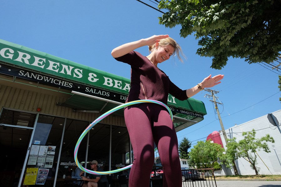Courtnay Curry tries out the hula hoops at Greens and Beans Deli in Sapperton, which is offering a free lunch special to anyone who drops by between 11 a.m. and 1 p.m. on weekdays and can hula hoop for 30 seconds.