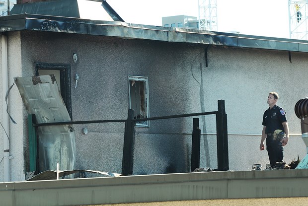 A North Vancouver City Fire Department member on the scene of a Central Lonsdale apartment fire Tuesday morning.