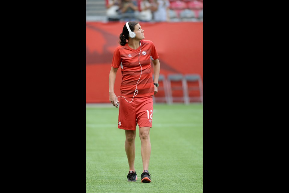 Christine Sinclair walks on the pitch at B.C. Place stadium in Vancouver on June 21, 2015.
