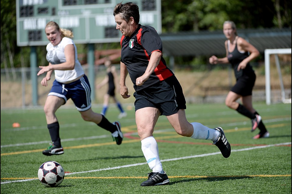 06-20-15
Team 2 takes on team 4 in the Burnaby 30 Something year-end wrap up tournament. The league focuses on fun, fitness and friendship and the tournament blends the players in the league to reflect those values.
Photo: Jennifer Gauthier