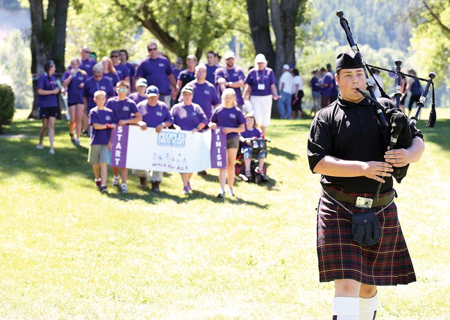 Piper Quinn Green, leads the procession of walkers on Sunday during the Walk for ALS in Lheidli T'enneh Memorial Park.