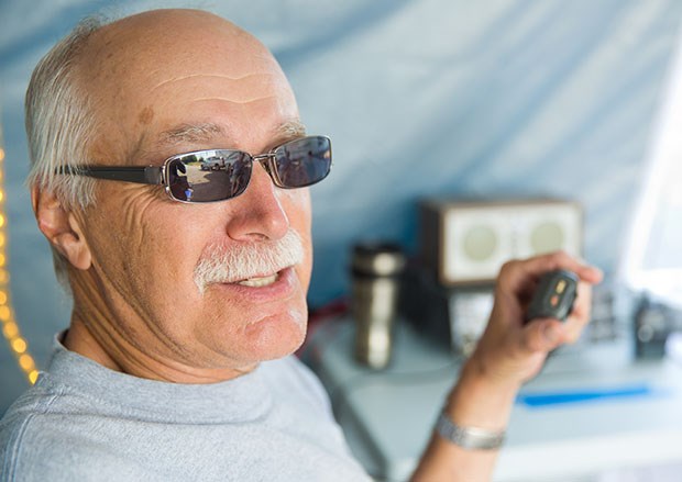 Rand Lutman with his Kenwood radio at the annual amateur radio Field Day June 27-28. The Delta Amateur Radio Society set up at the North 40 Park Reserve in Ladner to work as many stations as possible on amateur frequencies.