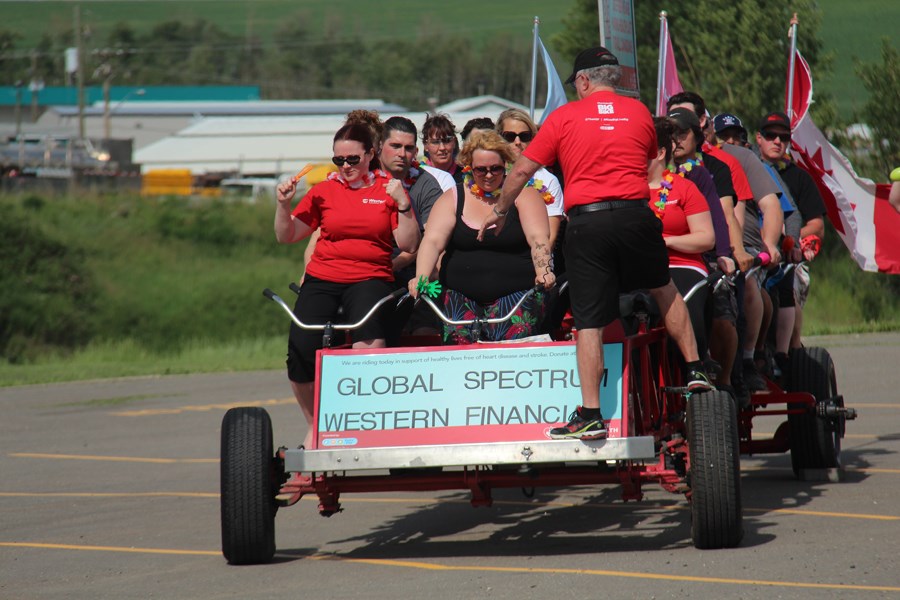 The team from Global Spectrum in Dawson Creek prepares for its big bike ride.