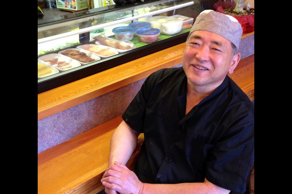 Joong Kim at his restaurant at Village Square.